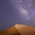 Night sky over sand dunes
